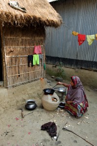 A woman cooks for her family in the rural community, Kaposhatia. 