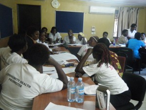 BRAC Uganda staff meet in small groups to brainstorm disaster response strategies.